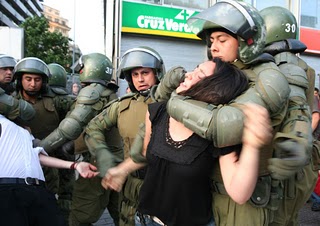 Mapuche woman being arrested